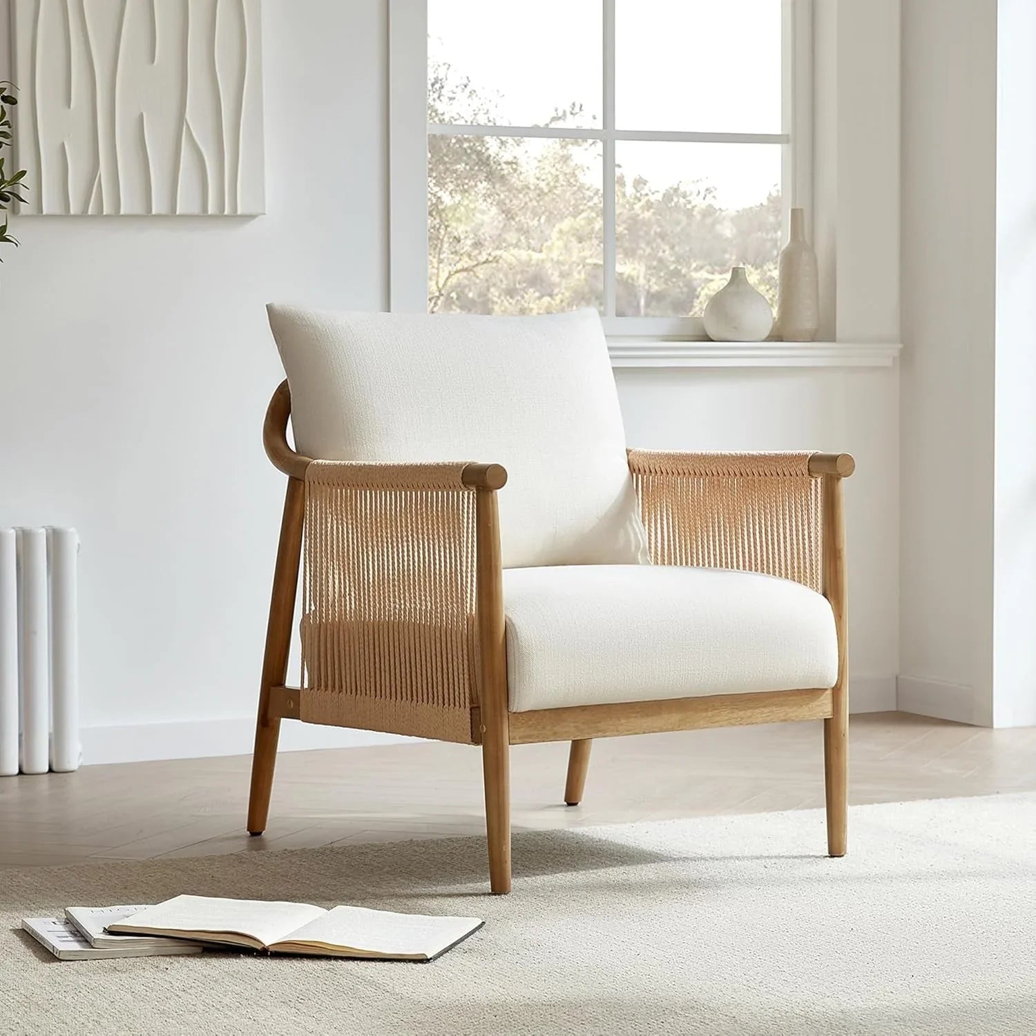 Coastal organic oak accent chair with woven cord sides and cream upholstered cushions.